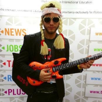 person with hat and guitar