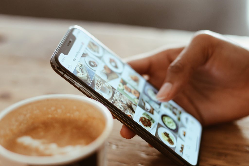 someone looking at social media on their phone