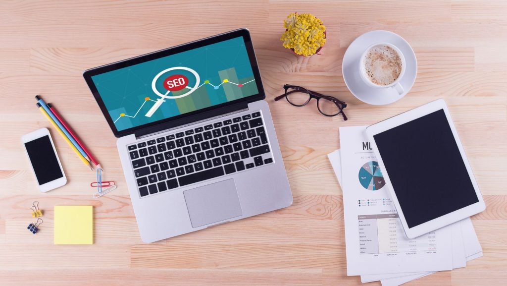 laptop-on-table-with-seo-on-screen